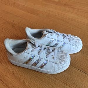 Adidas shell toe sneakers with silver stripes